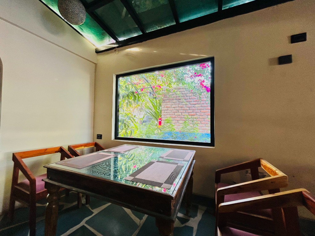 Atrium dining space with glass roof at Cafe 1010 Jodhpur